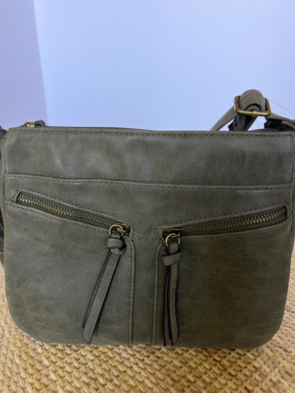 American Eagle vegan leather crossbody bag army green tassel 2 front zip pockets